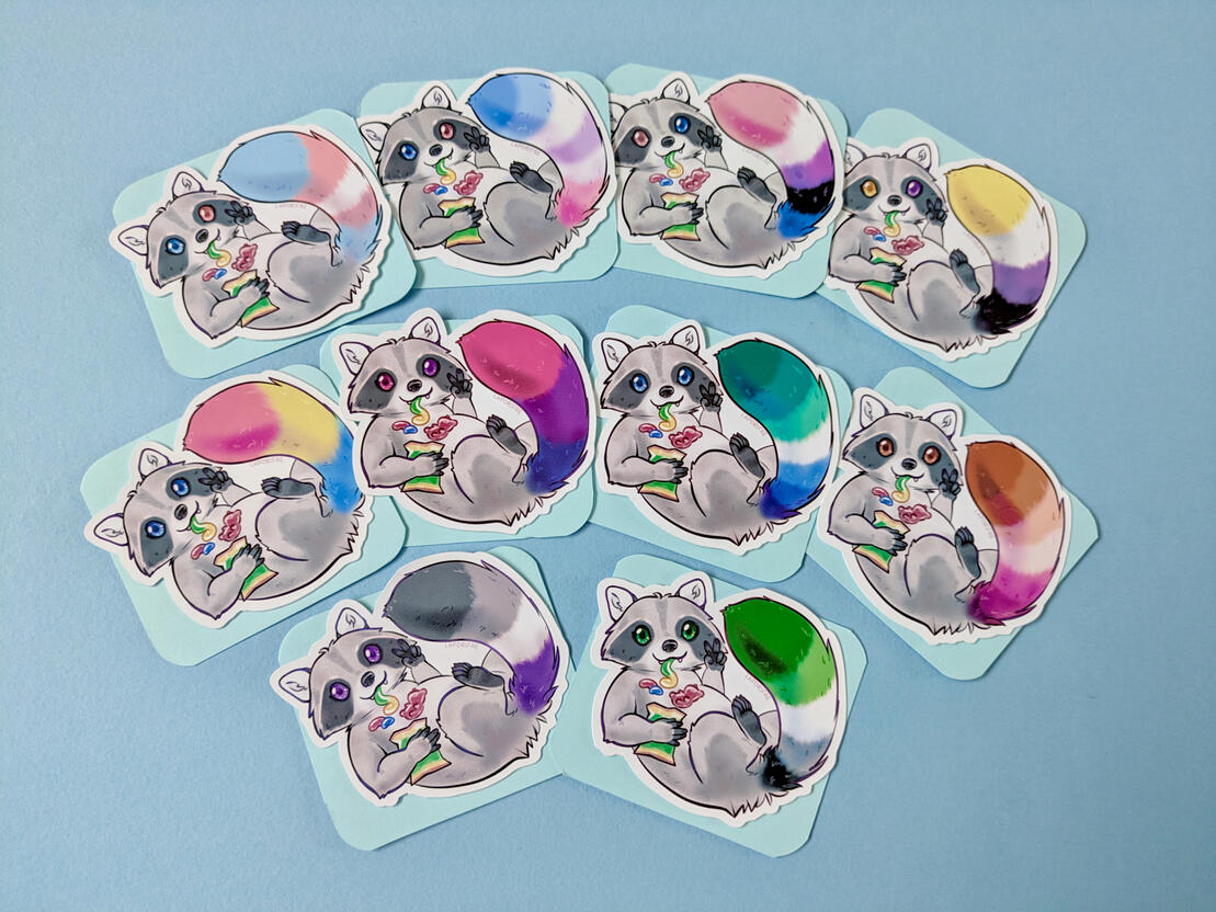 Cute raccoon stickers, the tails are coloured after various pride flags.